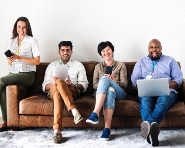 Individuals sitting on the lounge with devices-AI-Media